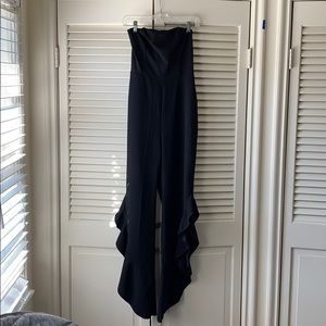 Strapless stretch black jumpsuit with ruffle legs